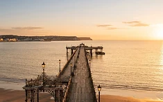RESTORATION OF HISTORIC PIER GATHERS PACE