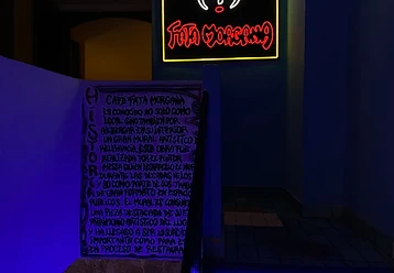 Neon sign and illuminated staircase