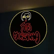 Cartel de neón circular de Fata Morgana