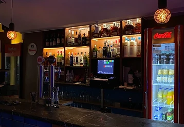 Bar with illuminated bottles
