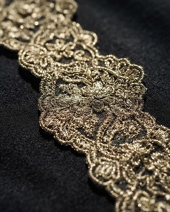 Gilded lace trimming detail