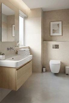 Hygienisch aufbereiteter Sanitärbereich einer Praxis mit Waschbecken und gepflegtem Boden