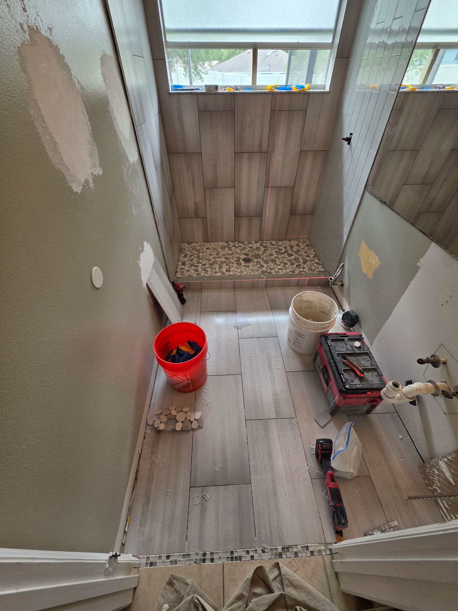 Bathroom tile installation and pebble stone shower floor in Largo FL.