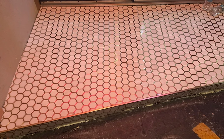 Hexagon mosaic tile installed on a commercial entryway and vertical face in Largo, FL