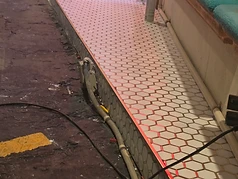 Tile installation layout and preparation at a commercial storefront in Largo, FL