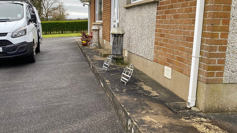 Cracked concrete driveway before renovation