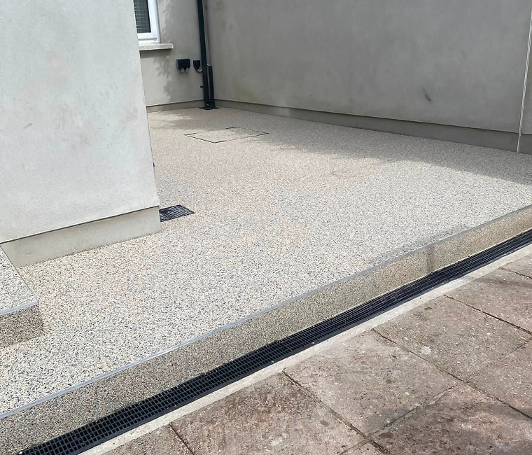 MS Resin craftspeople carefully finishing a driveway