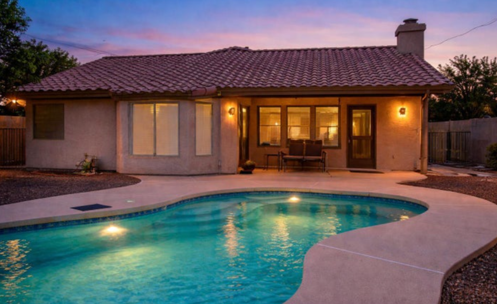 Digitally staged twilight pool in the private backyard