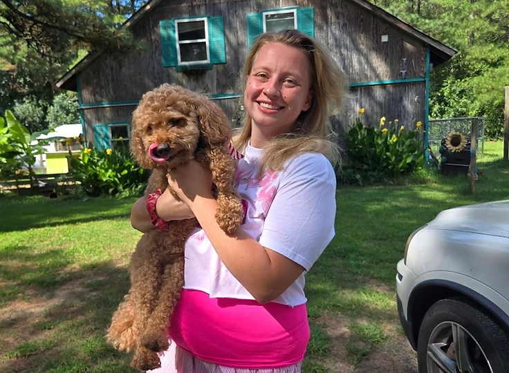 Chloe caring for dogs at The Barkyard Barn