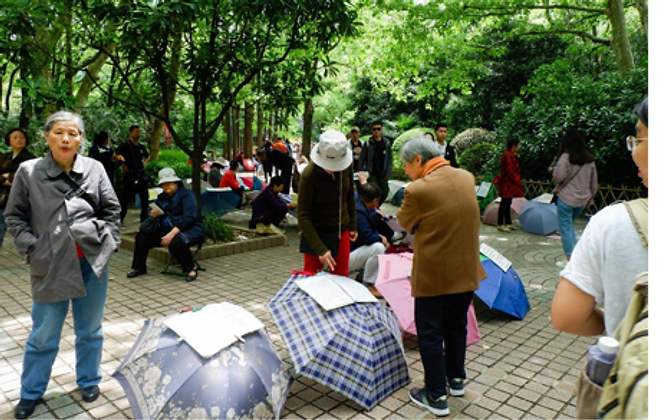 The People's Park marriage market — umbrellas laid out with handwritten profiles