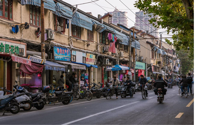 The Old City — a dense older neighbourhood with weathered stucco buildings and local shopfronts