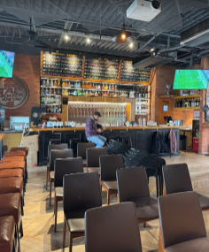 Tap House inside Shankang Li — wide tap wall, outdoor picnic benches, and the courtyard buzzing around you.