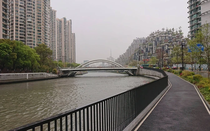 Suzhou Creek — the arched bridge and 1000 Trees development along the waterfront