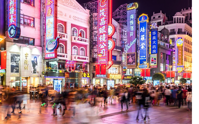 Nanjing Road Pedestrian Street at night — neon lights and Shanghai crowds