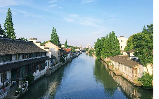 Qibao Ancient Town — stone bridges and canal-side façades