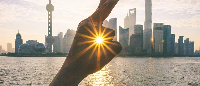 Sunrise over the Bund and the Lujiazui skyline.