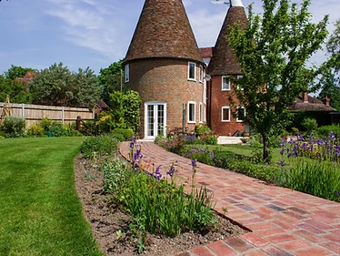 Brick path leading to a Kent oast house