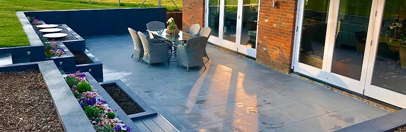 Landscaped garden with patio and lawn by Rogers Landscapes in Ashford, Kent
