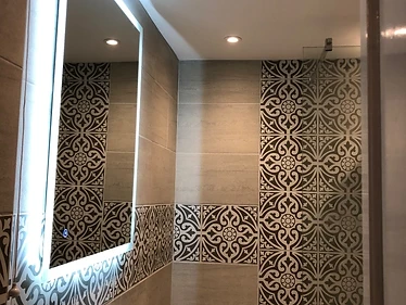 Shower room — feature tile band & back-lit mirror