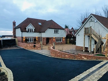 Roadway installation with extensive drainage, Flemish bond curved boundary walls, block paving & internal services