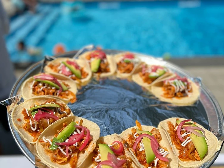 Private party taco catering with al pastor tacos outdoors