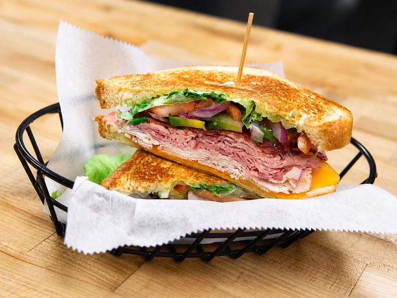 Club sandwich in a wire basket