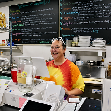 Smiling behind the counter