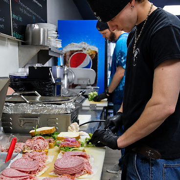 Assembling sandwiches in the kitchen