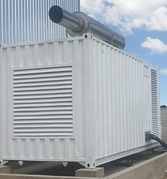 White weatherproof generator enclosure exterior with vertical exhaust