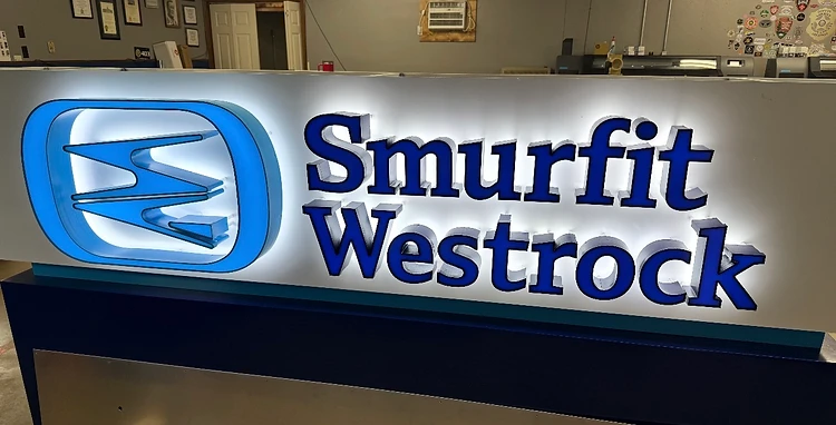 Laser-cut brushed metal custom sign with sparks frozen in motion