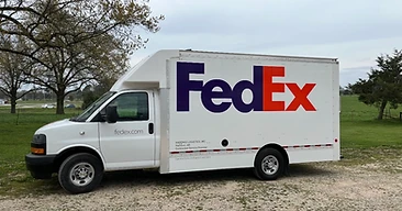 FedEx delivery truck with fleet graphics produced by Five-O Graphics in Harrison AR