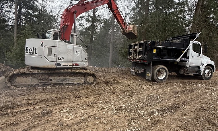 Alfieri Brothers excavator loading a dump truck on site