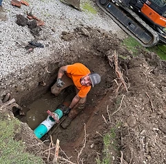 Alfieri Brothers crew member in the trench on a sewer repair
