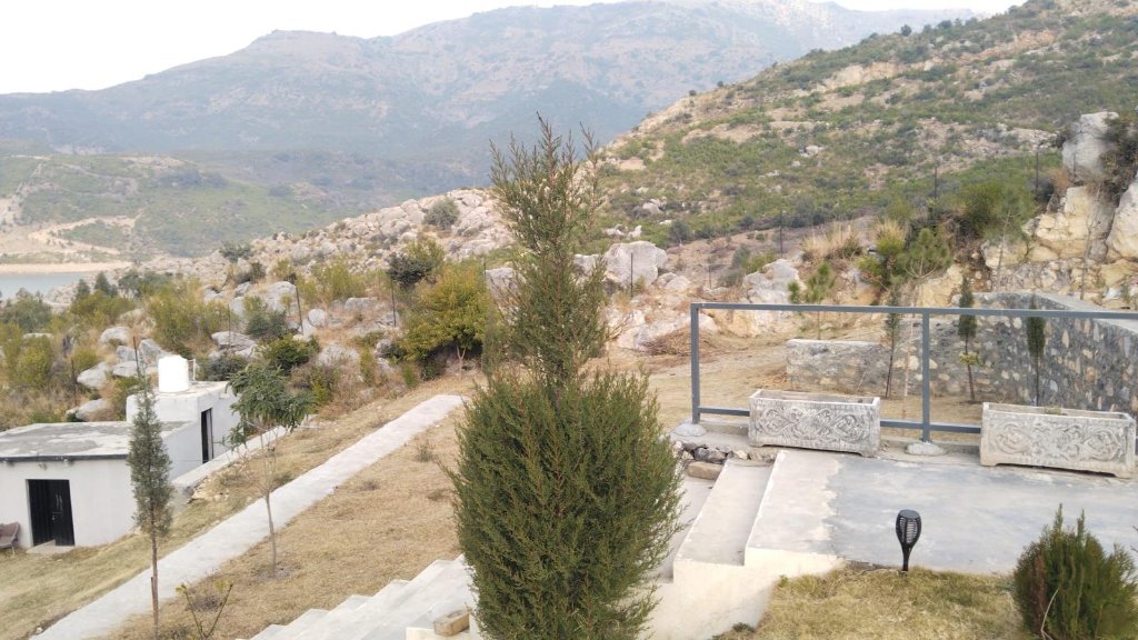 Panoramic turquoise lake view from the farmhouse balcony