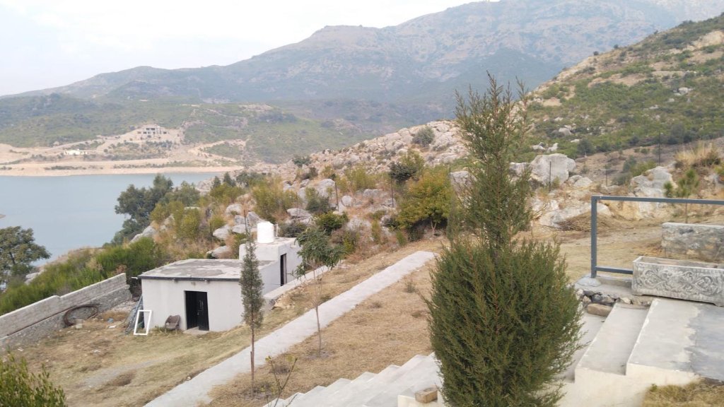 Stone terrace of the lakeside farmhouse at Khanpur Dam