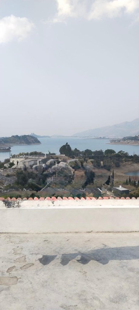 Lake view terrace overlooking the turquoise Khanpur Dam reservoir