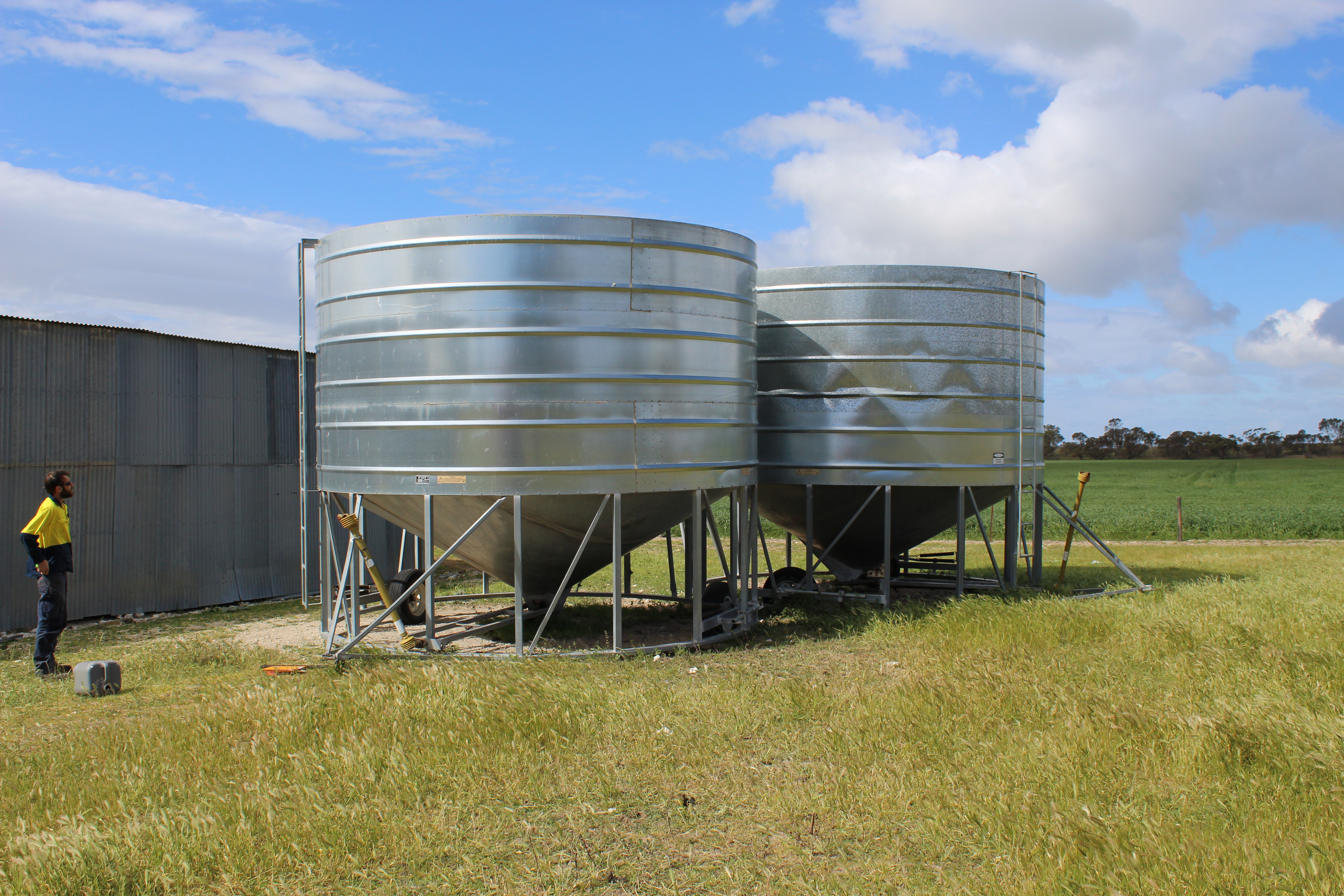 Galvanized Grain Silos in the Field