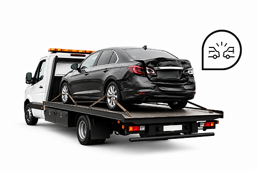 Damaged vehicle on flatbed tow truck