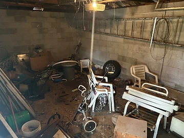 Cluttered garage filled with debris, chairs and boxes before cleanout in Evergreen Park