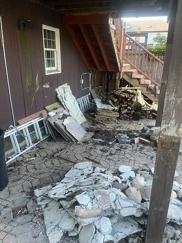 Cluttered patio filled with construction debris before removal in Mount Greenwood