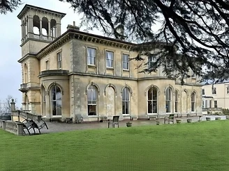 Bricklehampton Hall, a Grade II listed Italianate villa, viewed across the lawn