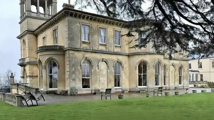 Bricklehampton Hall, a Grade II listed Italianate villa, viewed across the lawn