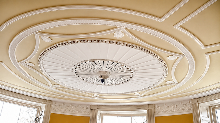 The completed circular ceiling dome and surrounding decorative plaster work at Vittoria House