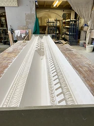 Modillion blocks being fixed to the cornice positive