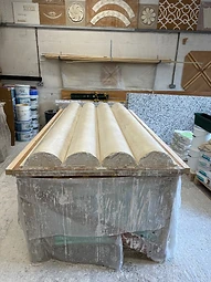 A large reverse mould prepared on the bench, ready for casting decorative plaster panels