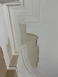 Restored cornice detail with bead-and-reel moulding
