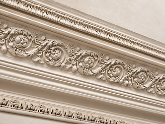Ornate Victorian plaster cornice with floral and scroll-work motifs in a Gloucestershire residence