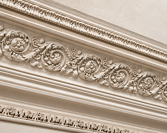 Ornate Victorian plaster cornice with floral and scroll-work motifs in a Gloucestershire residence