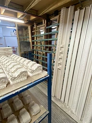 Freshly cast plaster elements arranged in the drying room