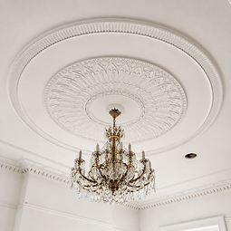 The completed drawing room ceiling with its ornate plaster rose and crystal chandelier